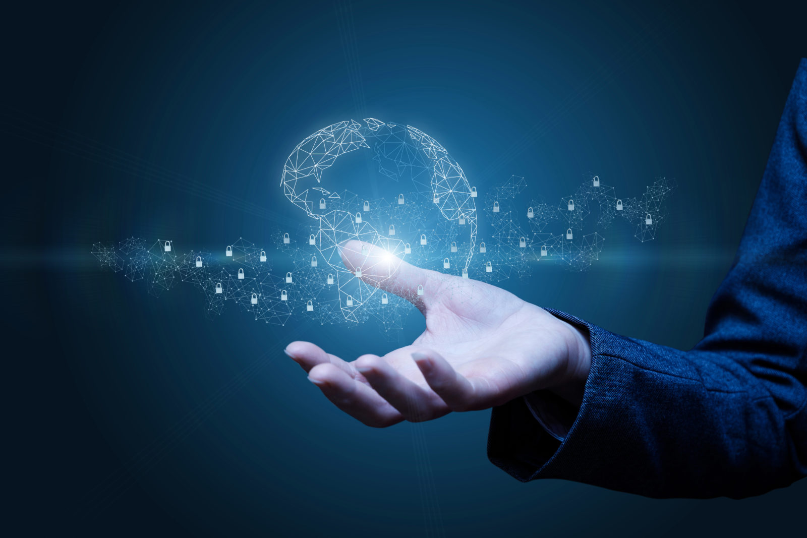 A businessman's hand showcasing a glowing light, symbolizing the power of Web Application Penetration Testing.
